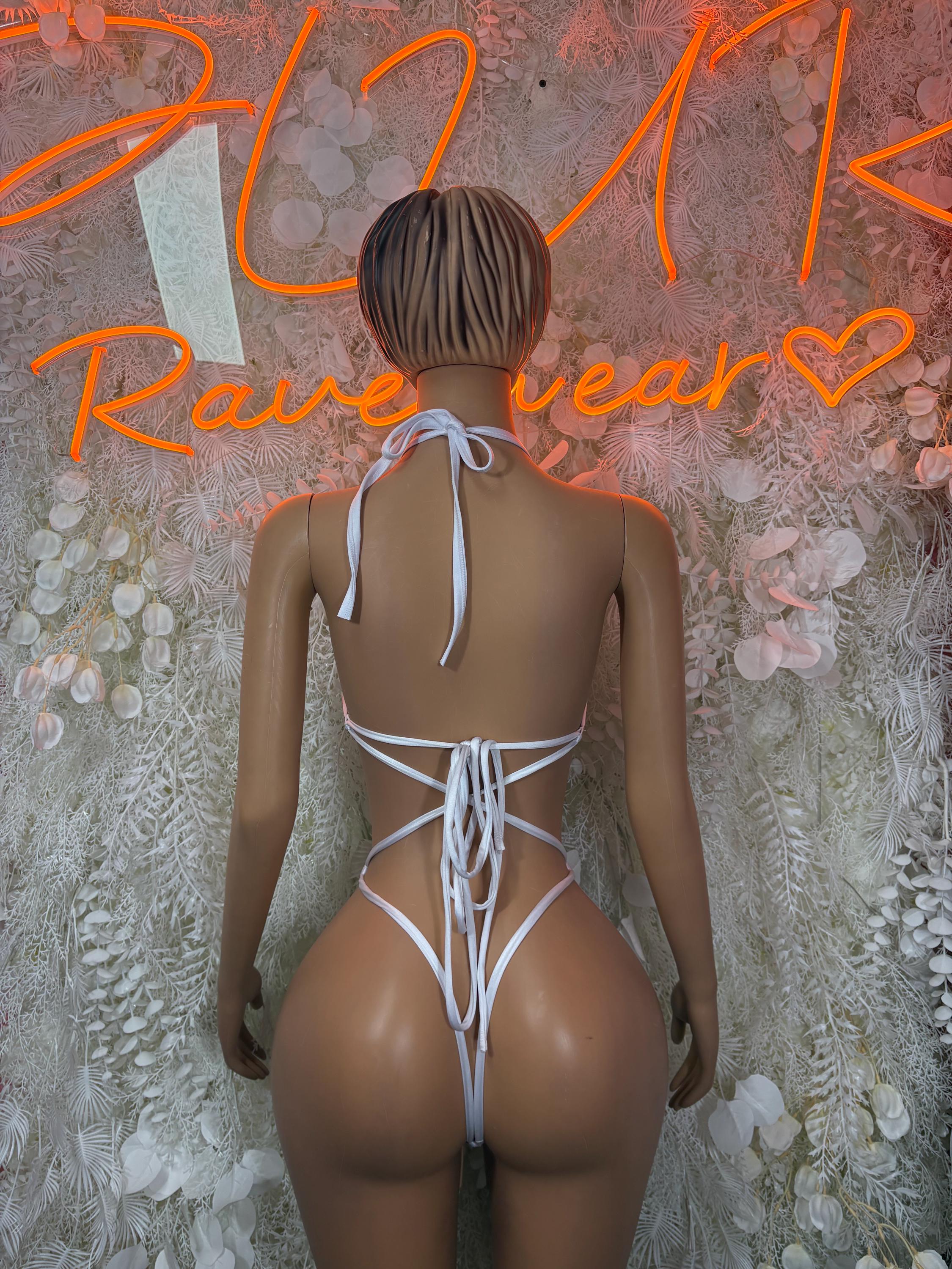 White fishnet bodysuit with open back and crisscross lace tie straps