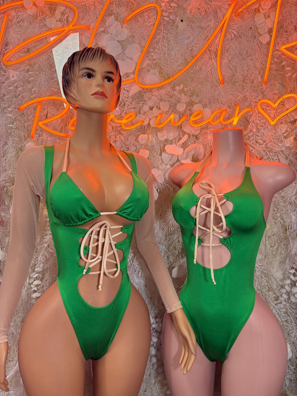 Green bodysuit with scoop neckline, front lace-up detail and halter straps