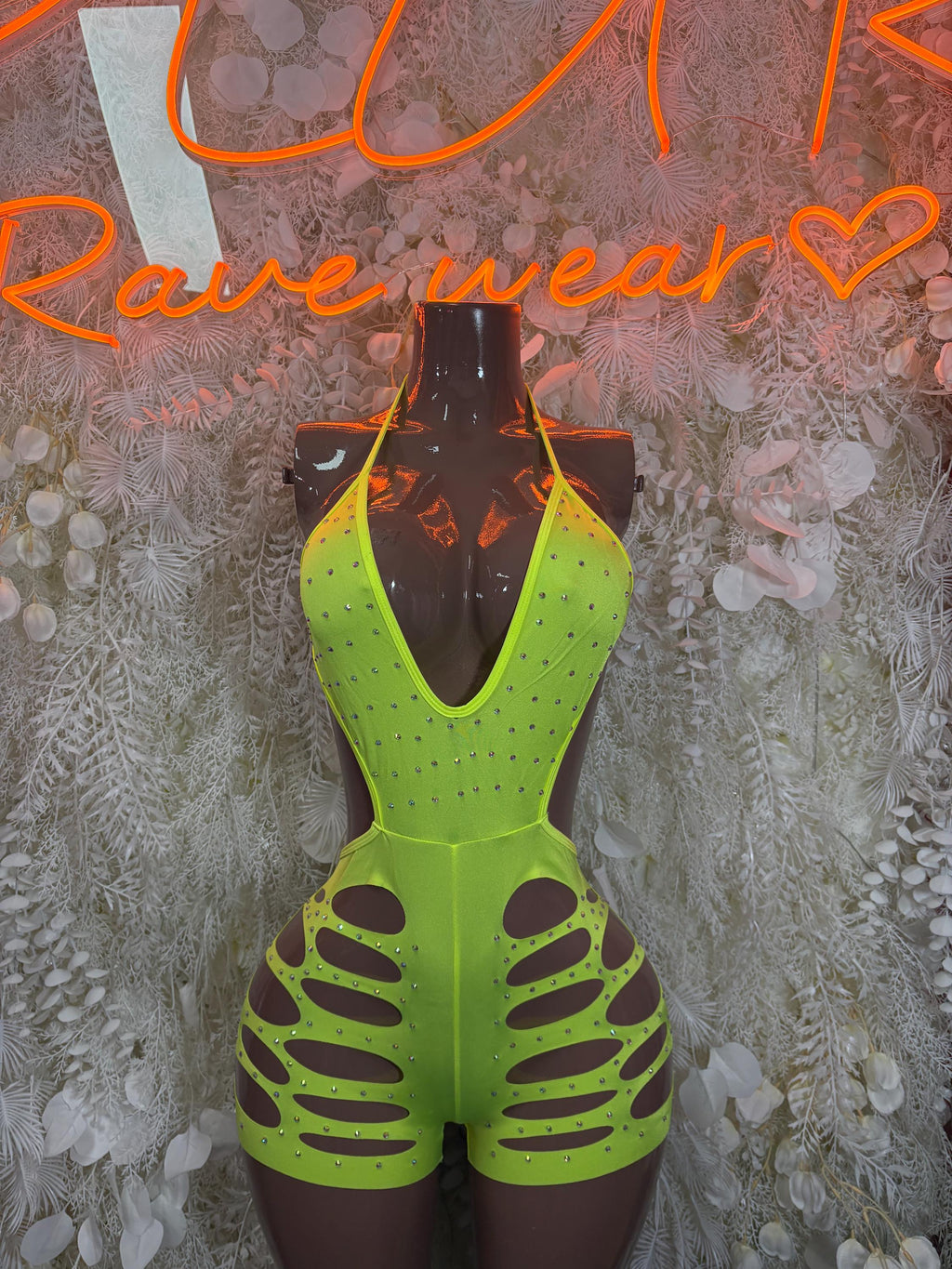 Neon green cutout bodysuit with deep V neckline and lace-up style front