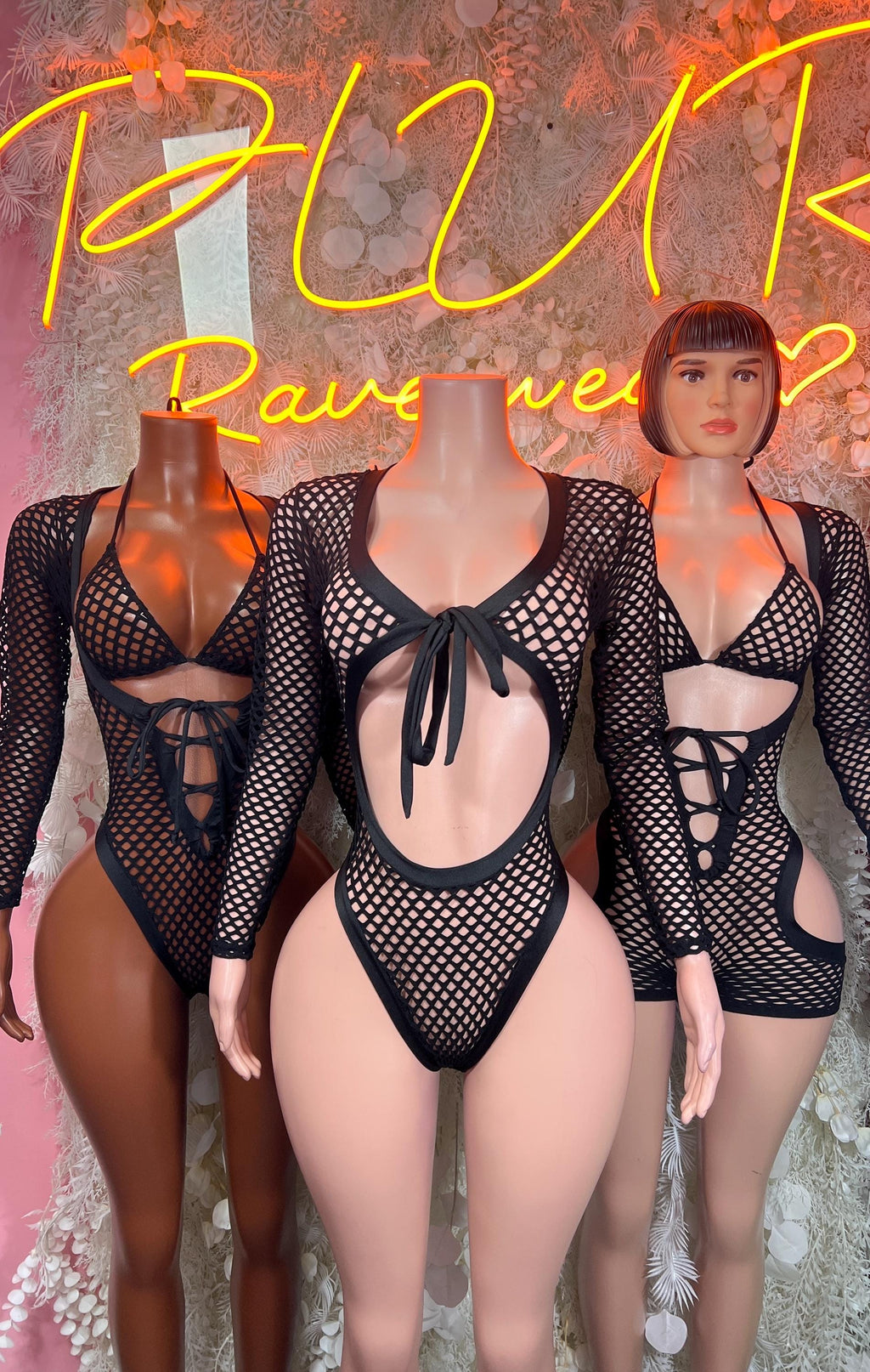 Black fishnet bodysuit with lace-up chest and open back cutout