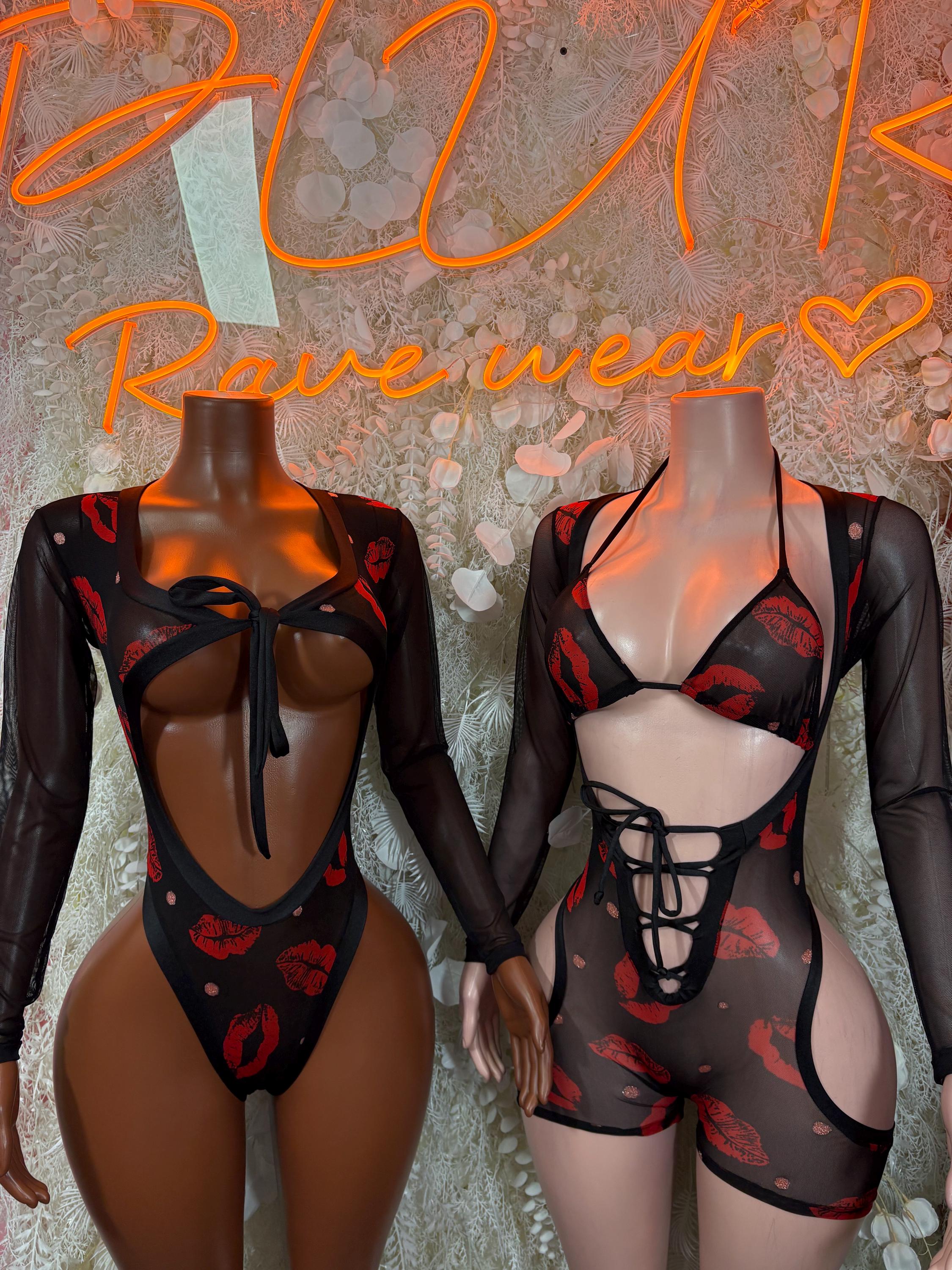 Black sheer bodysuit with red heart print, lace-up chest detail and long sleeves