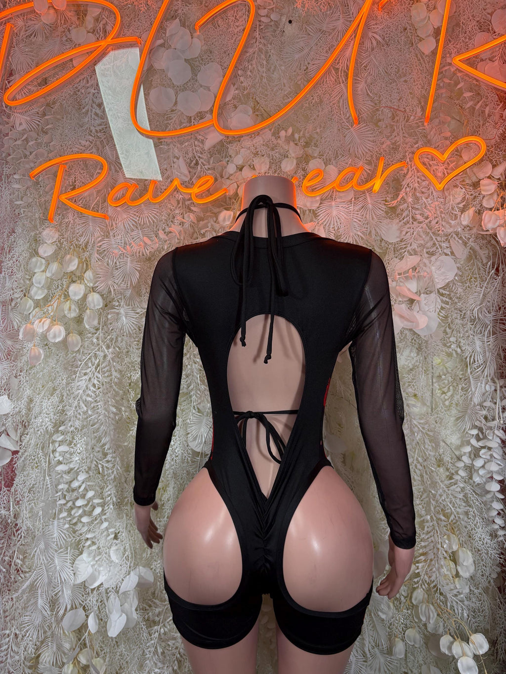 Black sheer long-sleeve bodysuit with open back and red heart print lace-up straps