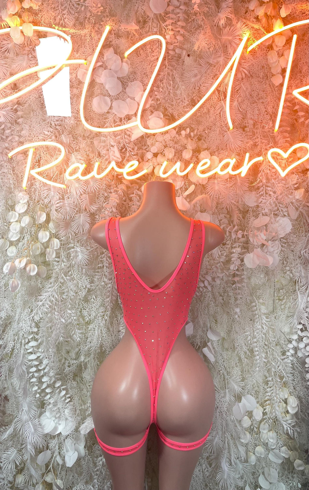 Pink rhinestone backless bodysuit with U-shaped back and high-cut leg straps
