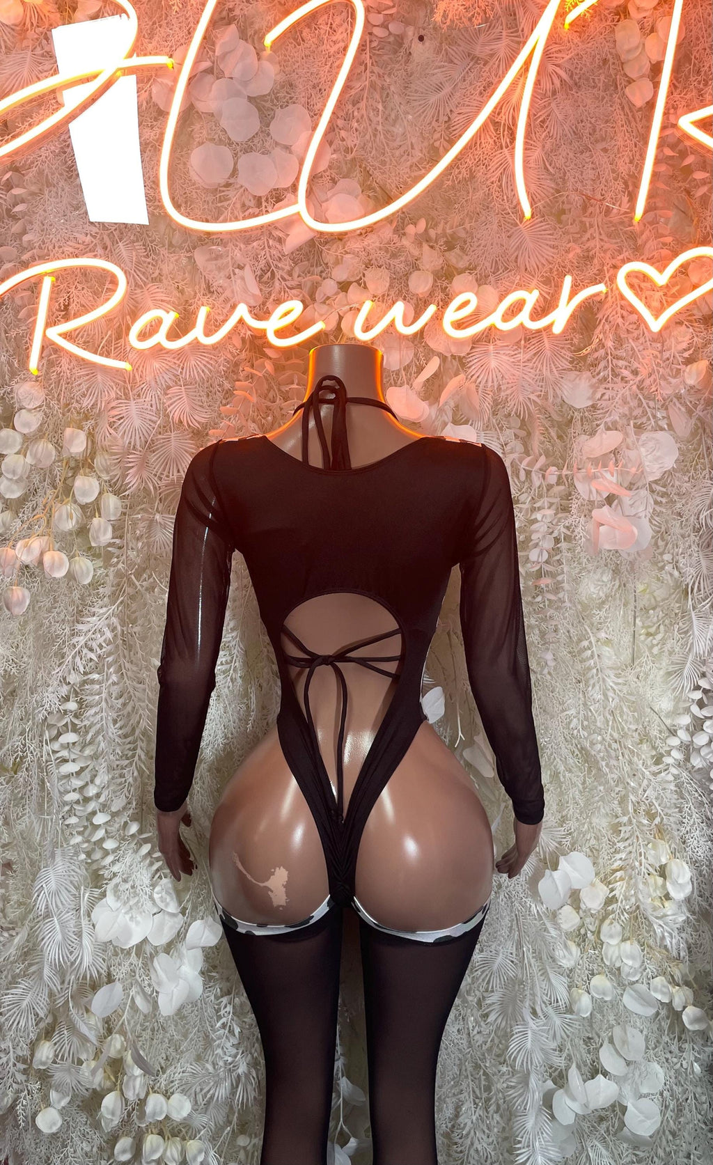 Cow print bodysuit with open back lace tie, long sheer sleeves, black and white