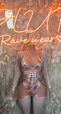Orange cow print bodysuit with long sheer sleeves, lace-up front and open waist cutout