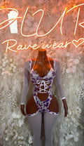 Purple cow print bodysuit with lace-up front, long sleeves, sheer mesh panels