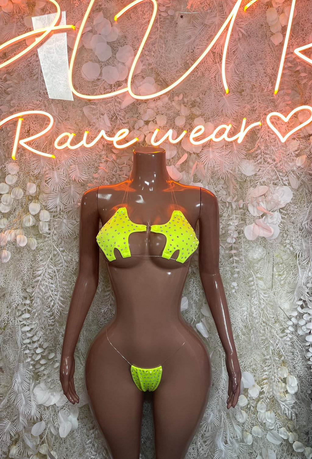 Neon green rhinestone bikini set on mannequin, triangle bra and matching thong bottom