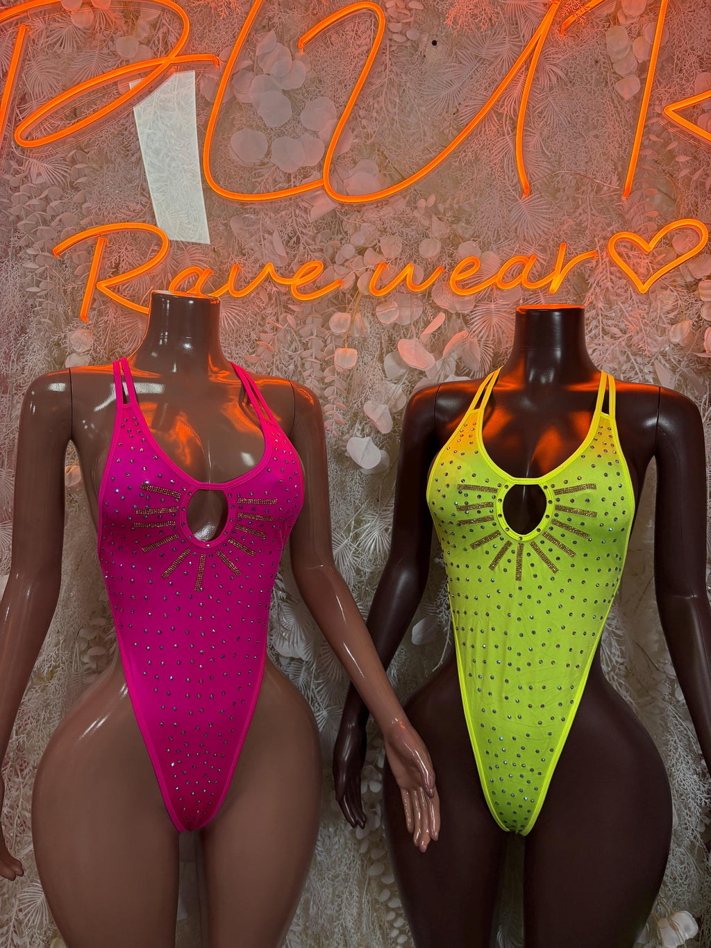 Two rhinestone festival bodysuits: pink and neon yellow, scoop neckline and cutout
