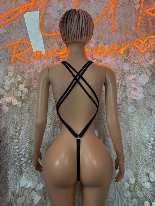 Back view of black rhinestone bodysuit with crisscross straps and keyhole cutout