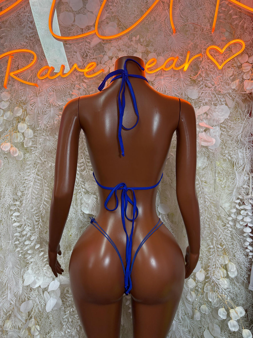 Blue rhinestone bikini set, open-back halter with tie straps, back view.