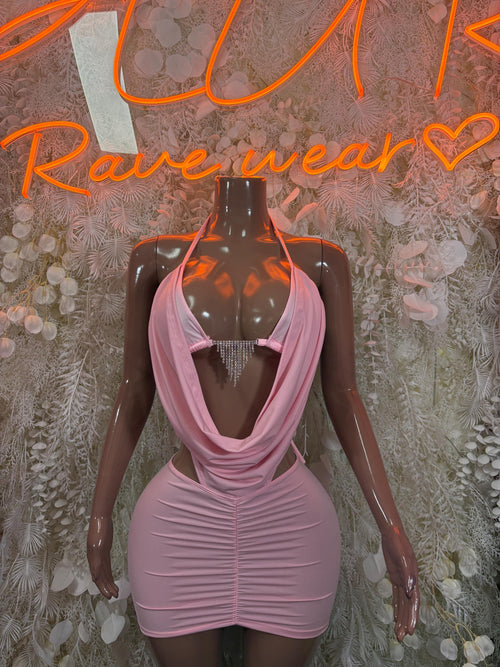 Baby pink mini dress with halter cowl neckline and ruched fitted skirt on mannequin