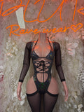 Black sheer-sleeve metallic bodysuit with blue iridescent sequins, lace-up front and cutouts