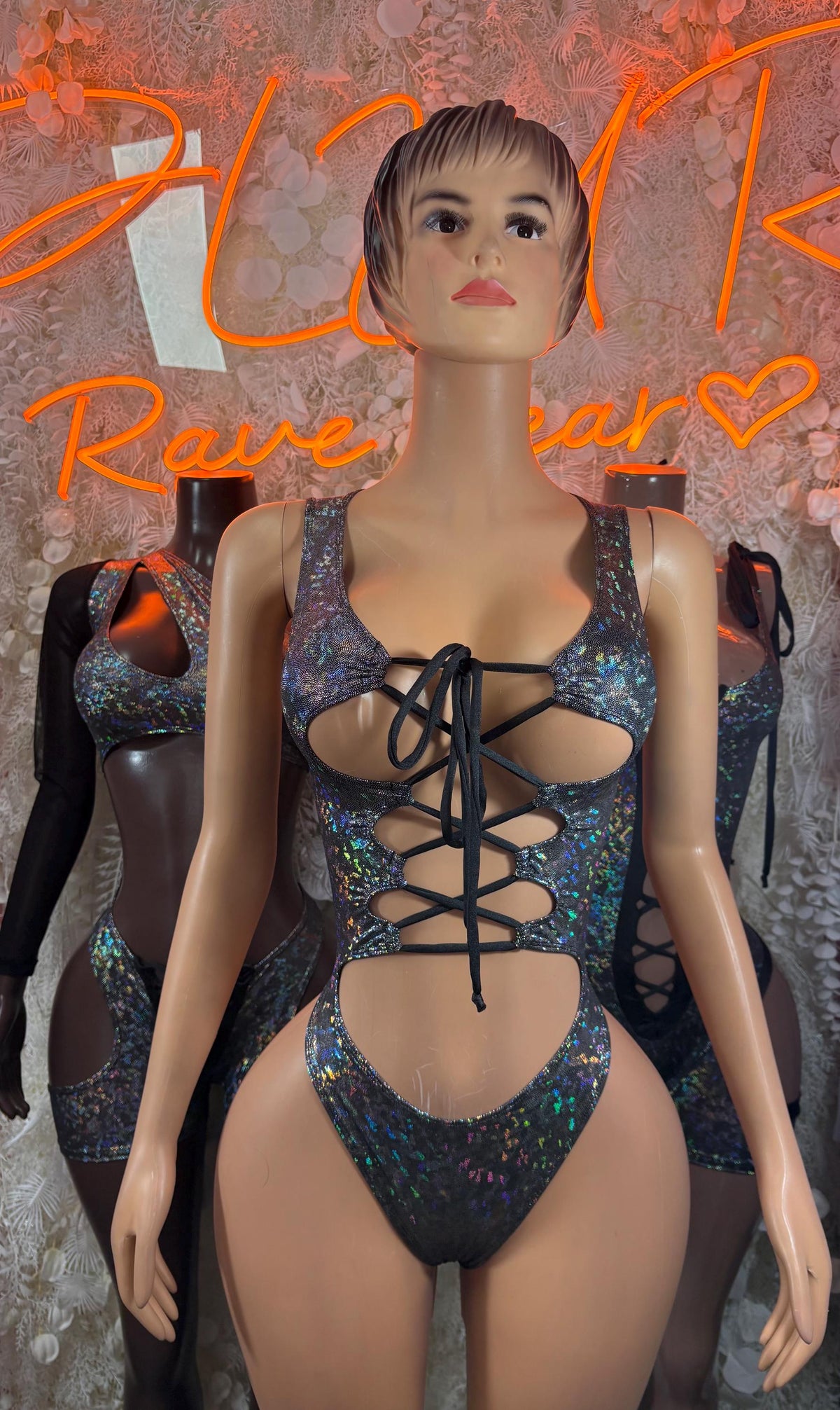 Black metallic blue one-piece bodysuit with lace-up chest and sheer side cutouts