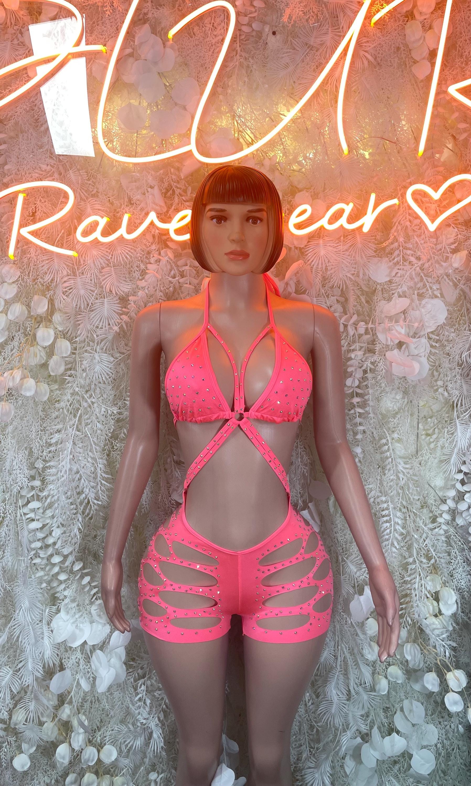 Coral pink halter bodysuit with rhinestone-style trim and cutout shorts front