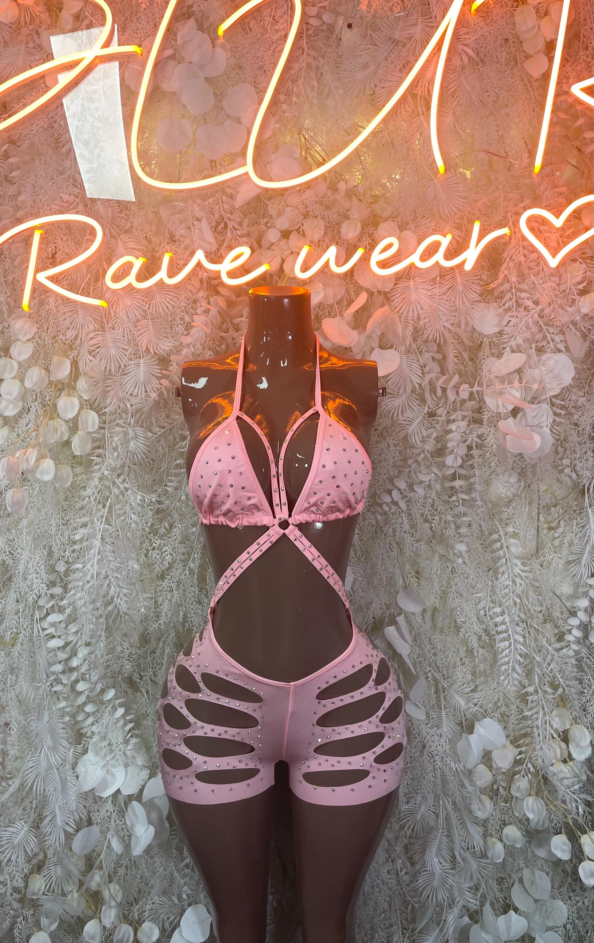 Pink rhinestone bodysuit with halter straps and oval chest cutout, skeletal leg cutouts