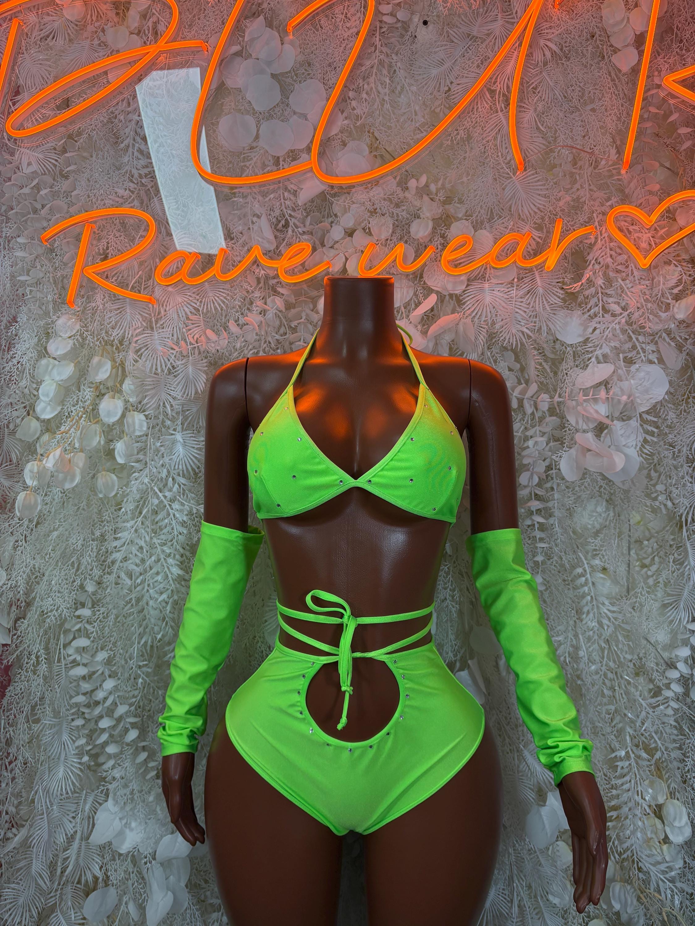 Neon green rave two-piece festival outfit with long sleeves, bra top, high-rise bottoms