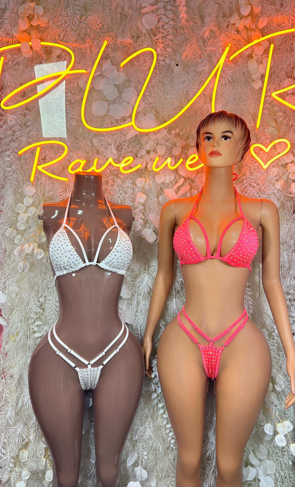 White and pink rhinestone bikini sets on two mannequins