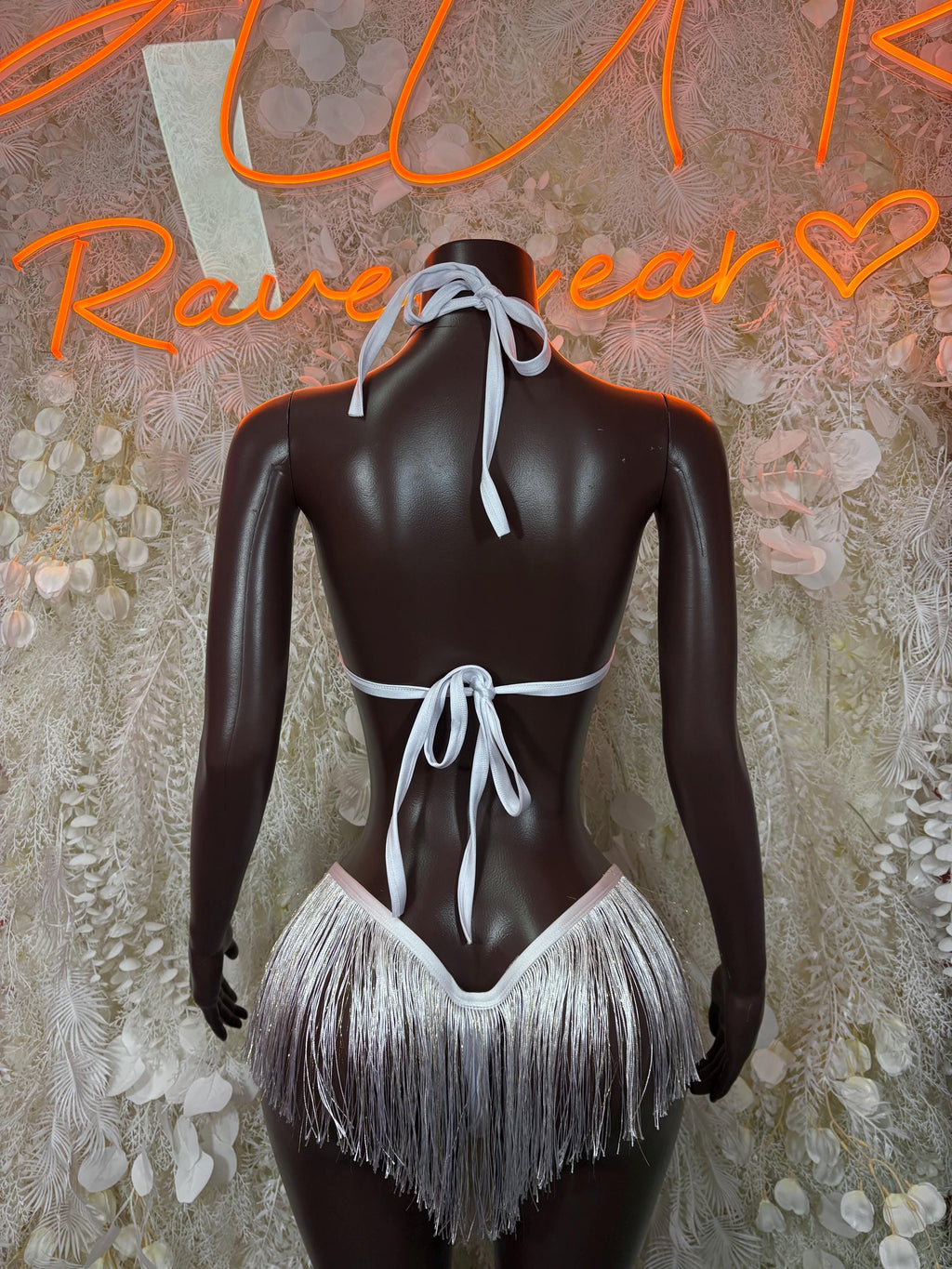 Back view of white fringe two-piece set with halter ties and bikini bottom