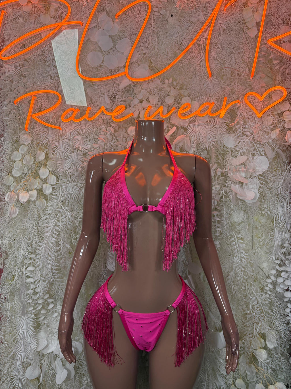 Pink fringe two-piece festival bikini set on mannequin, tie-front top and matching bottoms