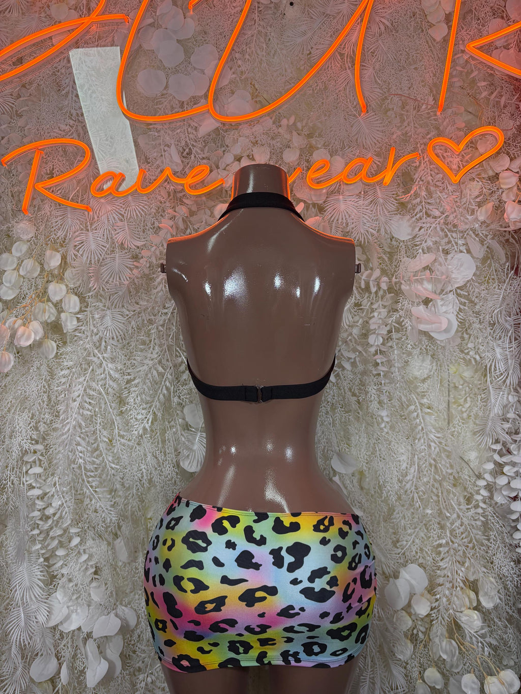 Rainbow leopard print two-piece rave outfit: black halter back and mini skirt