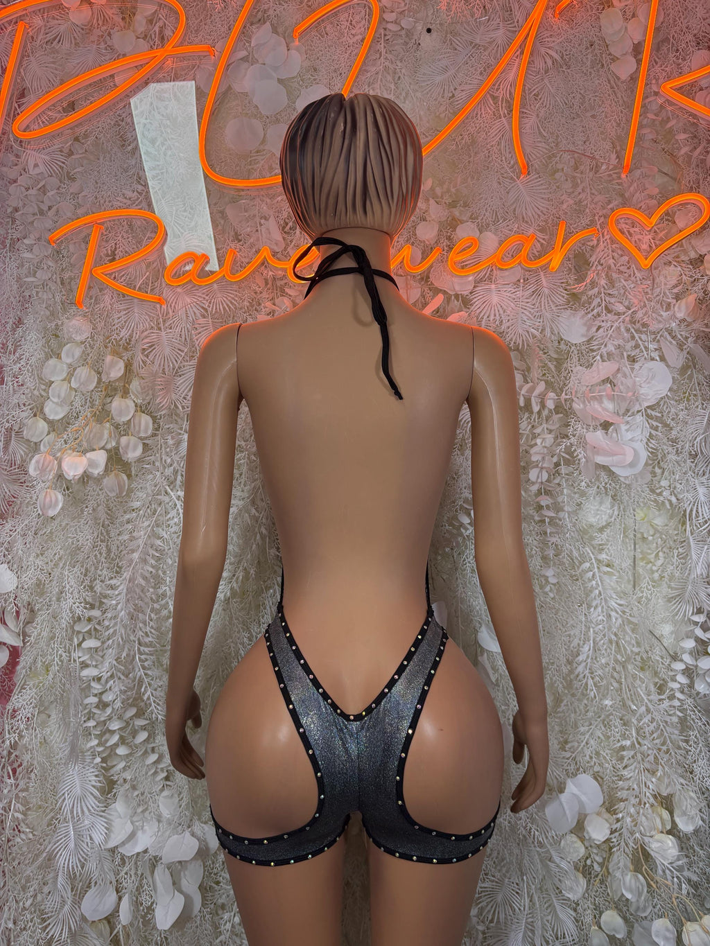 Black fishnet backless bodysuit with halter straps and rhinestone bands