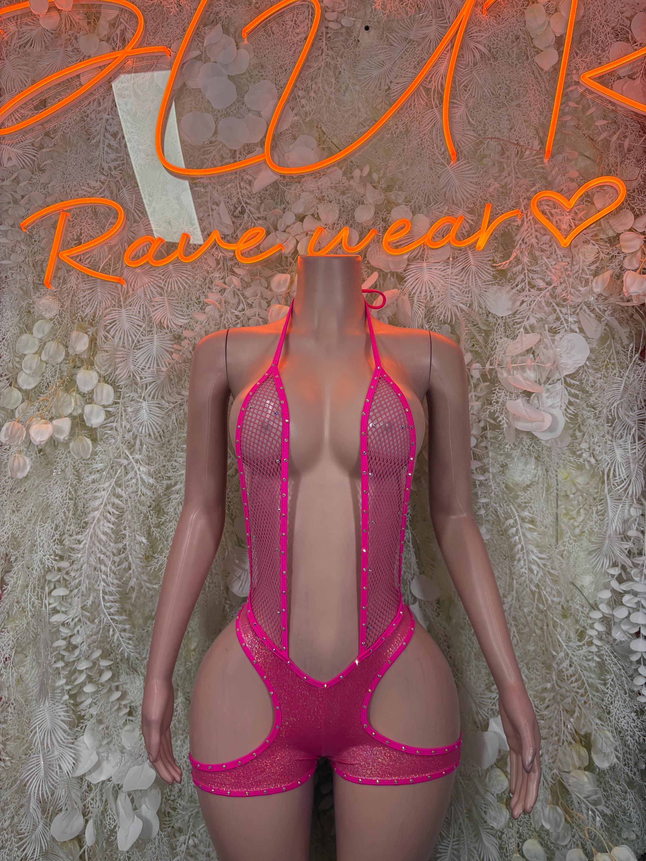 Pink fishnet bodysuit with halter straps and rhinestone trim, front view