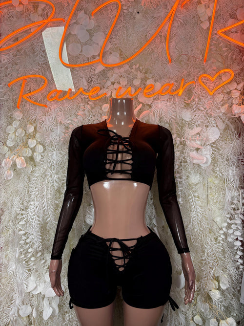 Black lace-up long-sleeve bodysuit with cutout bust and matching high-cut shorts