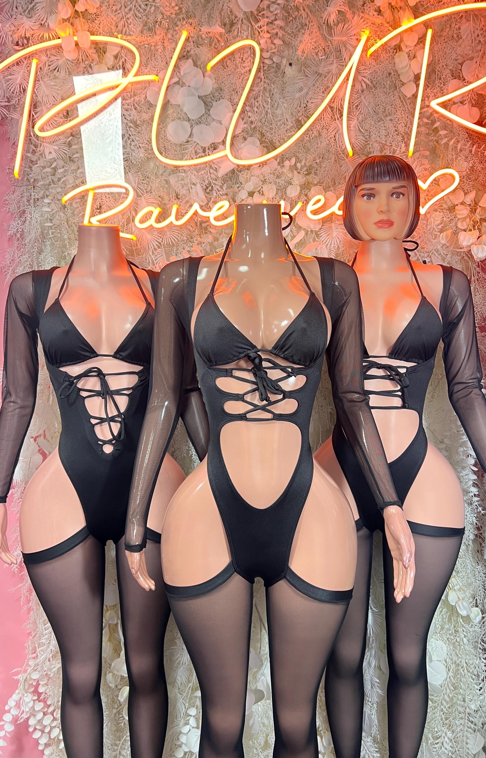 Black lace-up bodysuit with cutout bust, long sleeves, sheer mesh panels