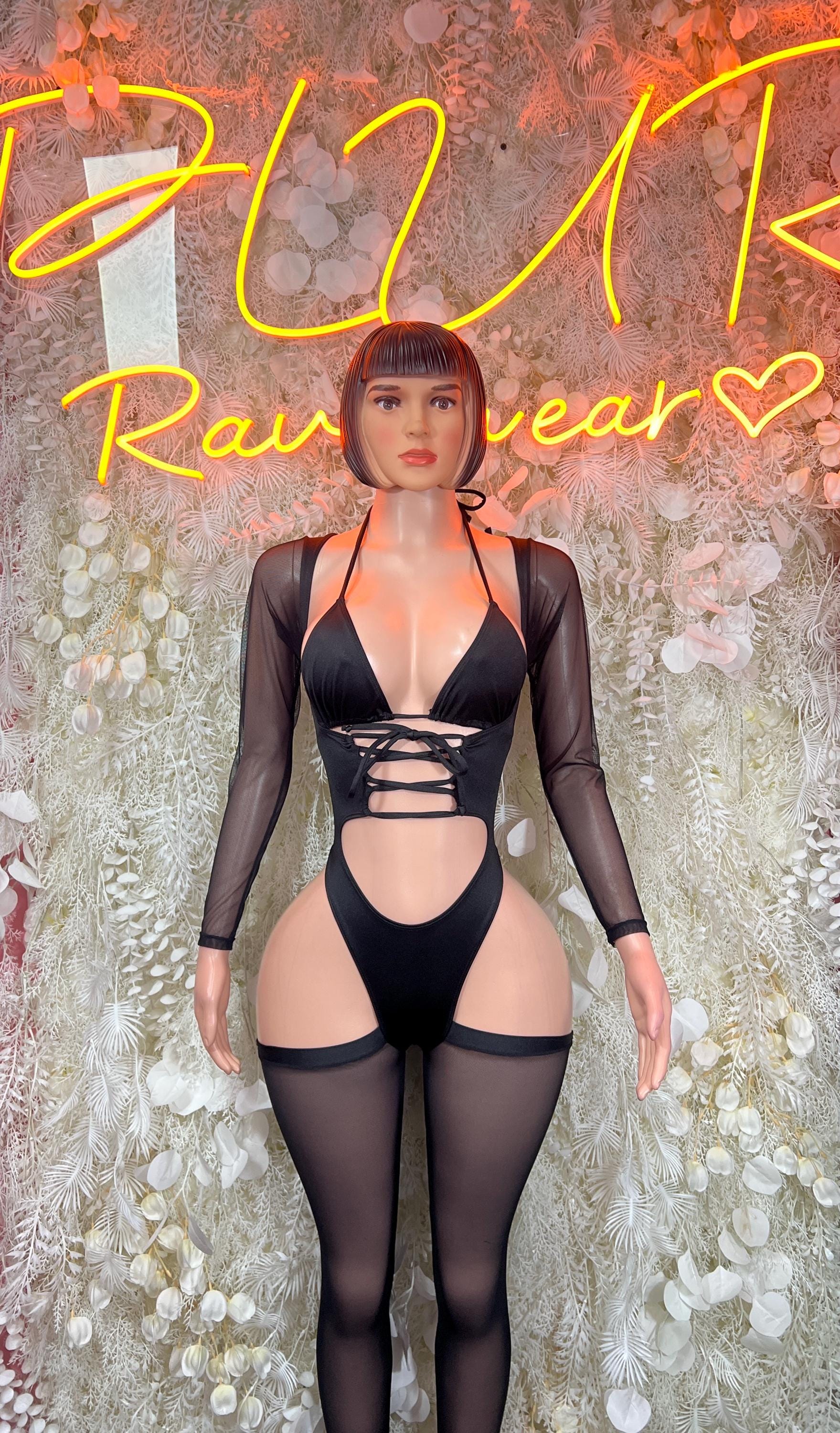 Black lace-up bodysuit with long sleeves and deep V neckline