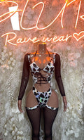 Cow print bodysuit with lace-up front, long sheer sleeves, black and white panels