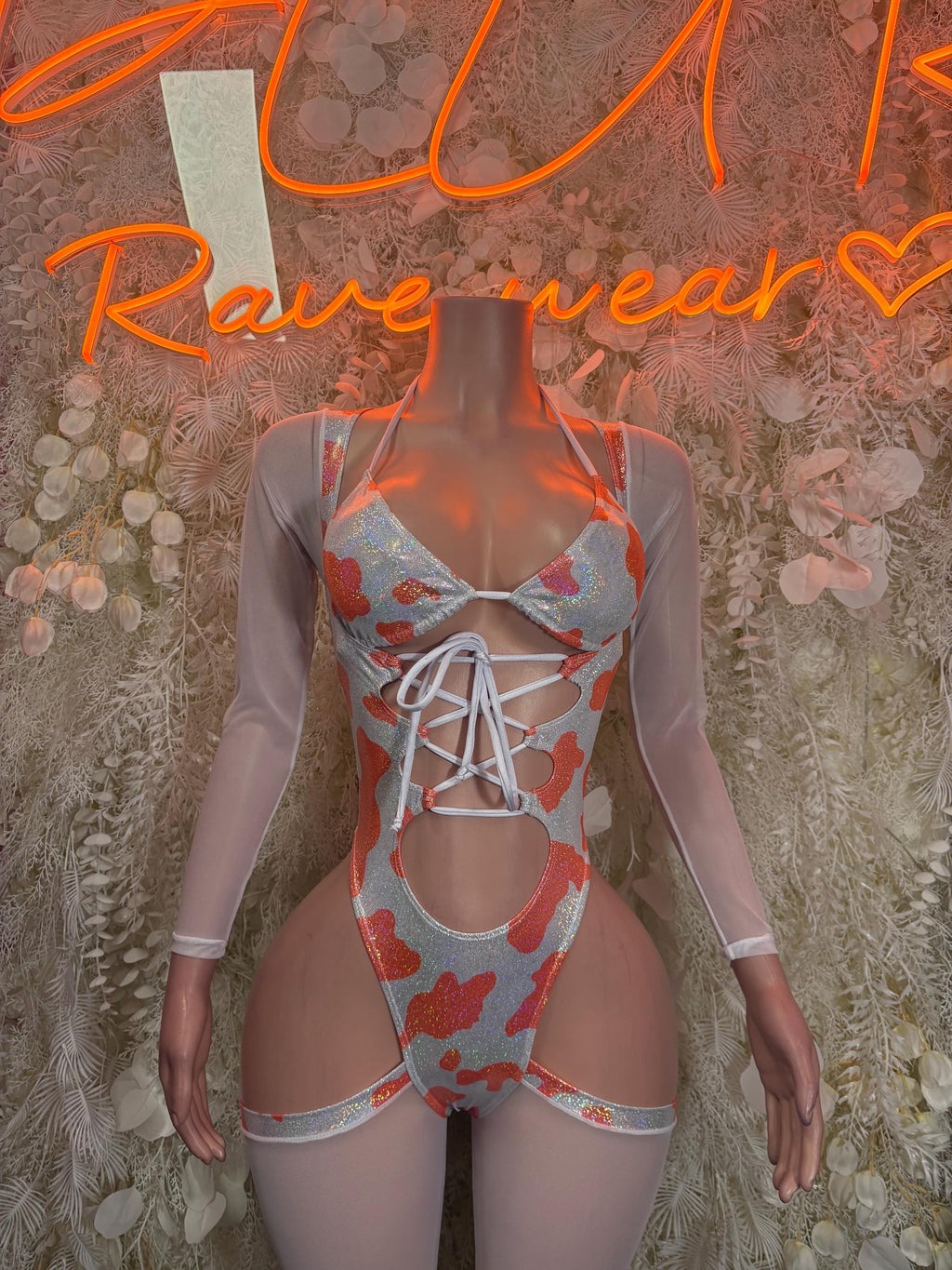 Orange heart-print lace-up bodysuit with sheer long sleeves and high-cut leg panels