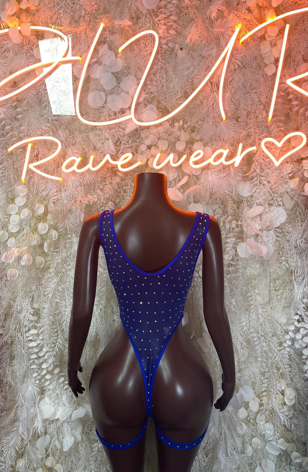 Blue rhinestone bodysuit with V-back, sleeveless high-cut front on mannequin