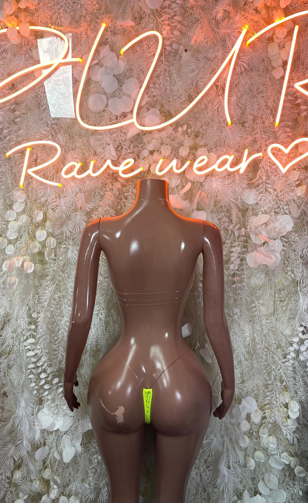 Neon green rhinestone bikini set on mannequin, V-front top and high-cut bottom
