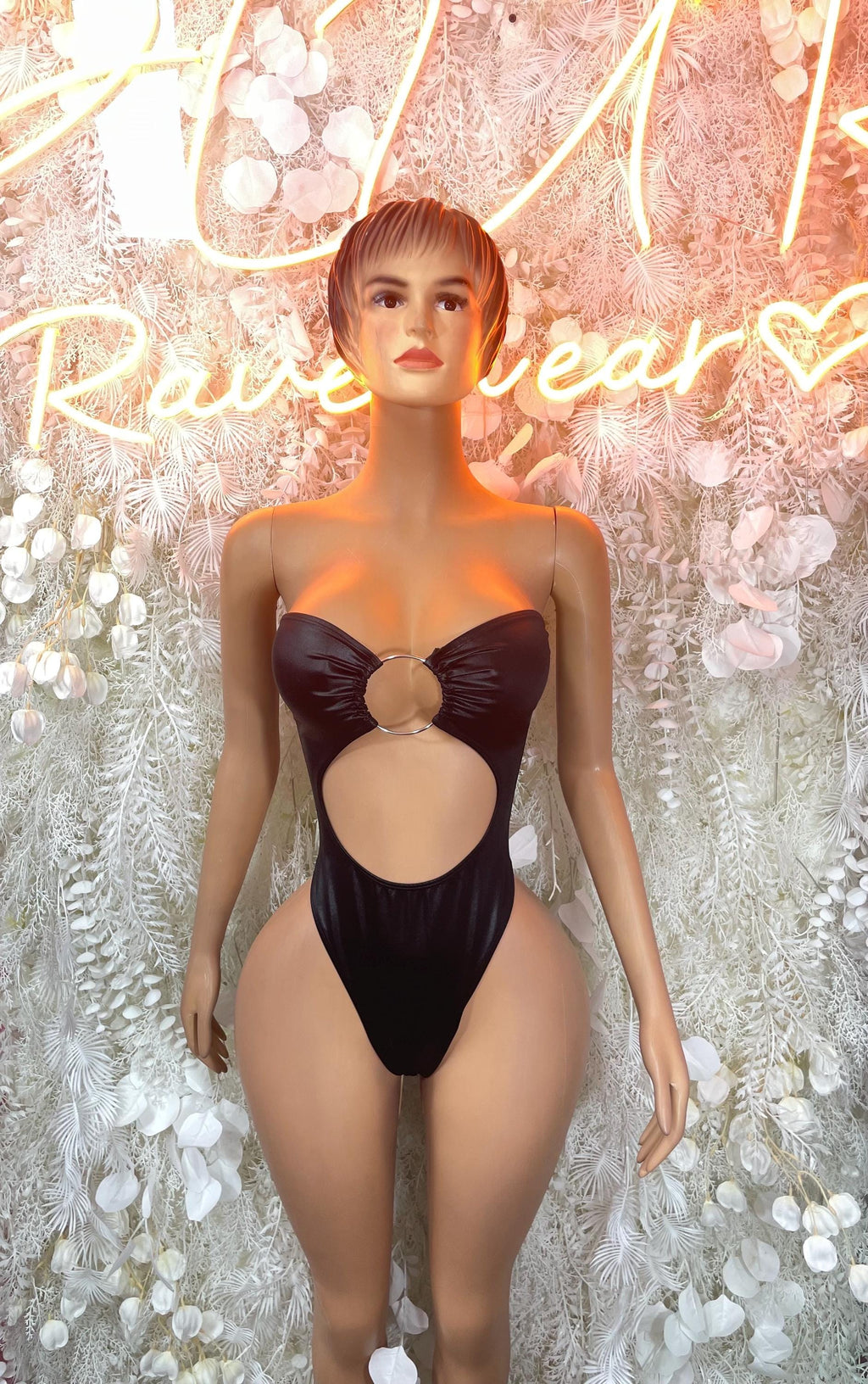 Black strapless bodysuit with sweetheart neckline, ring cutout at bust and front cutout