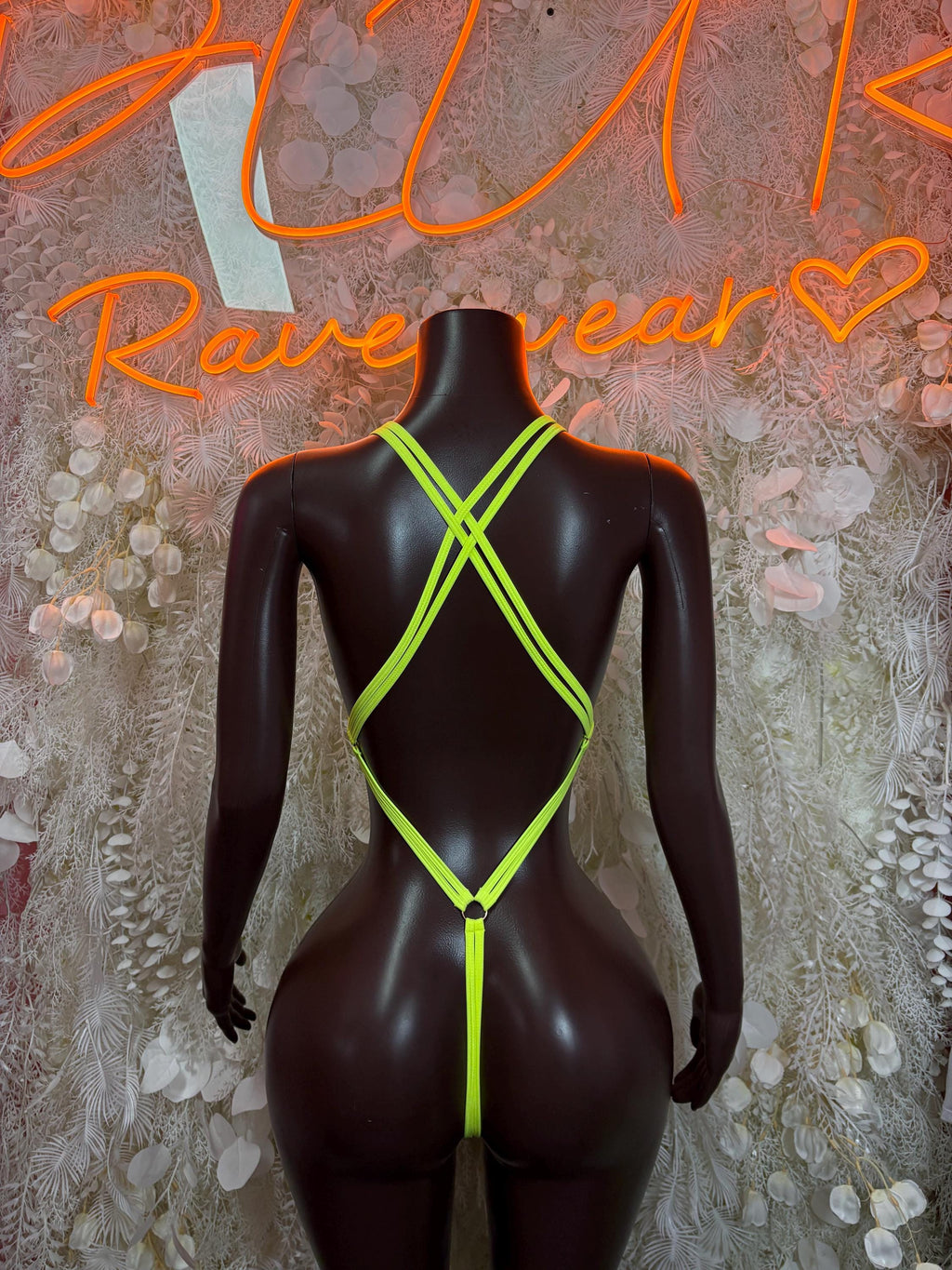 Neon green rhinestone bodysuit back view with crisscross straps and thong back