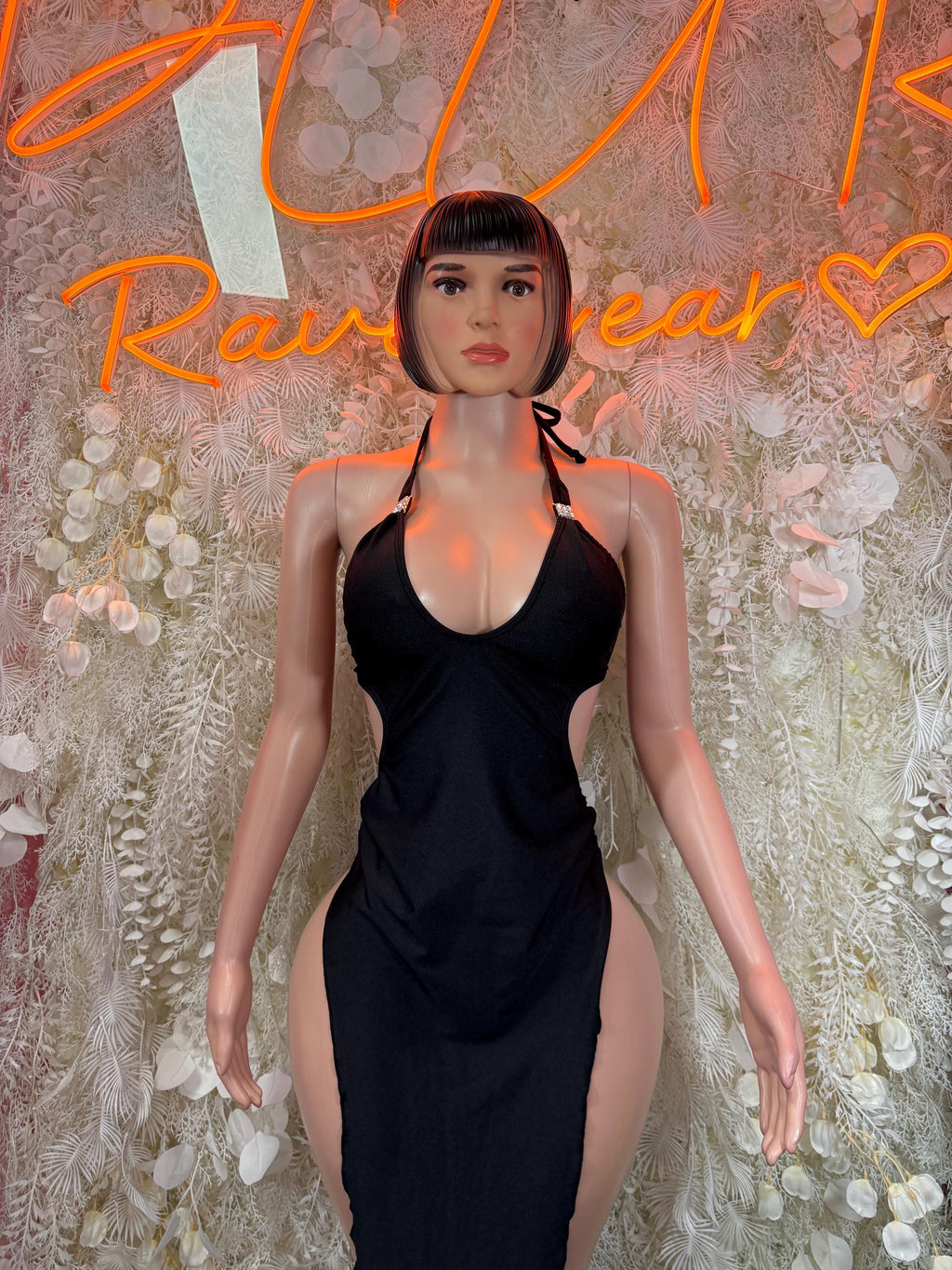 Black halter rave dress with strappy neckline and ruched bodycon skirt