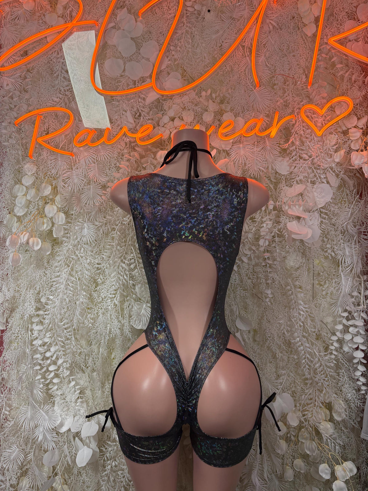 Black metallic halter bodysuit with deep V cutout front and open back, thong style
