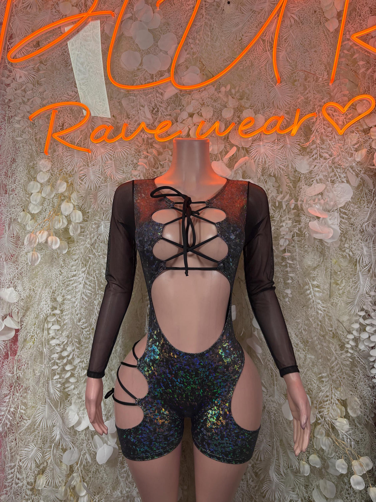 Black sheer long-sleeve bodysuit with holographic blue-green lace-up cutouts