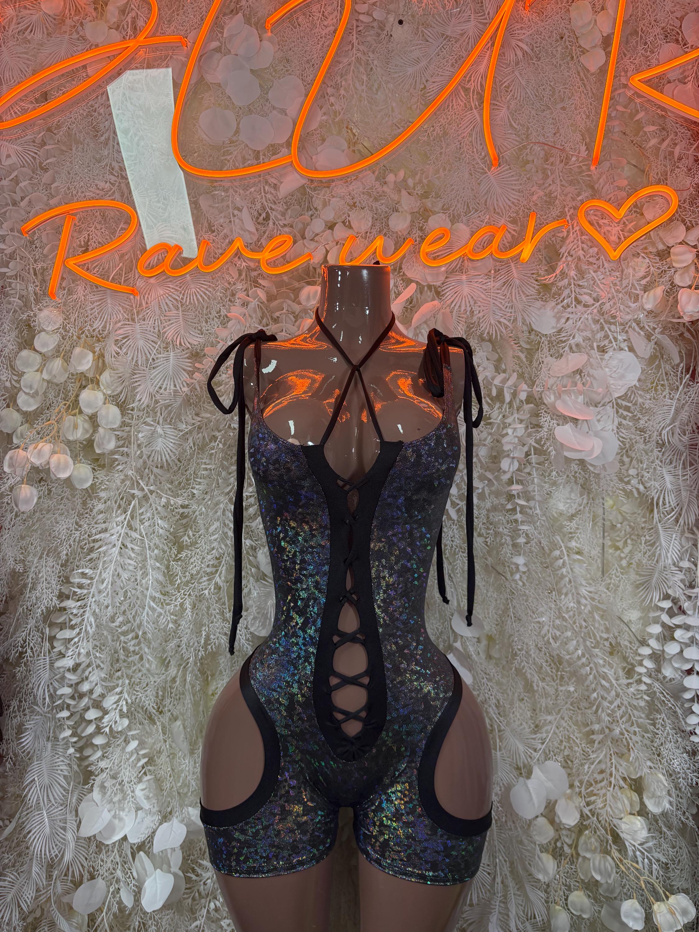 Black metallic cutout lace-up bodysuit with sheer panels and high-leg bottoms