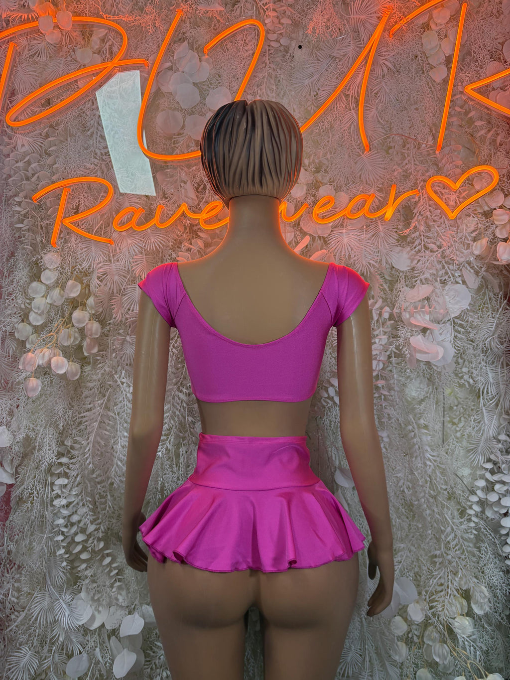 Pink backless two-piece skirt set with tie-string top and flared ruffled skirt