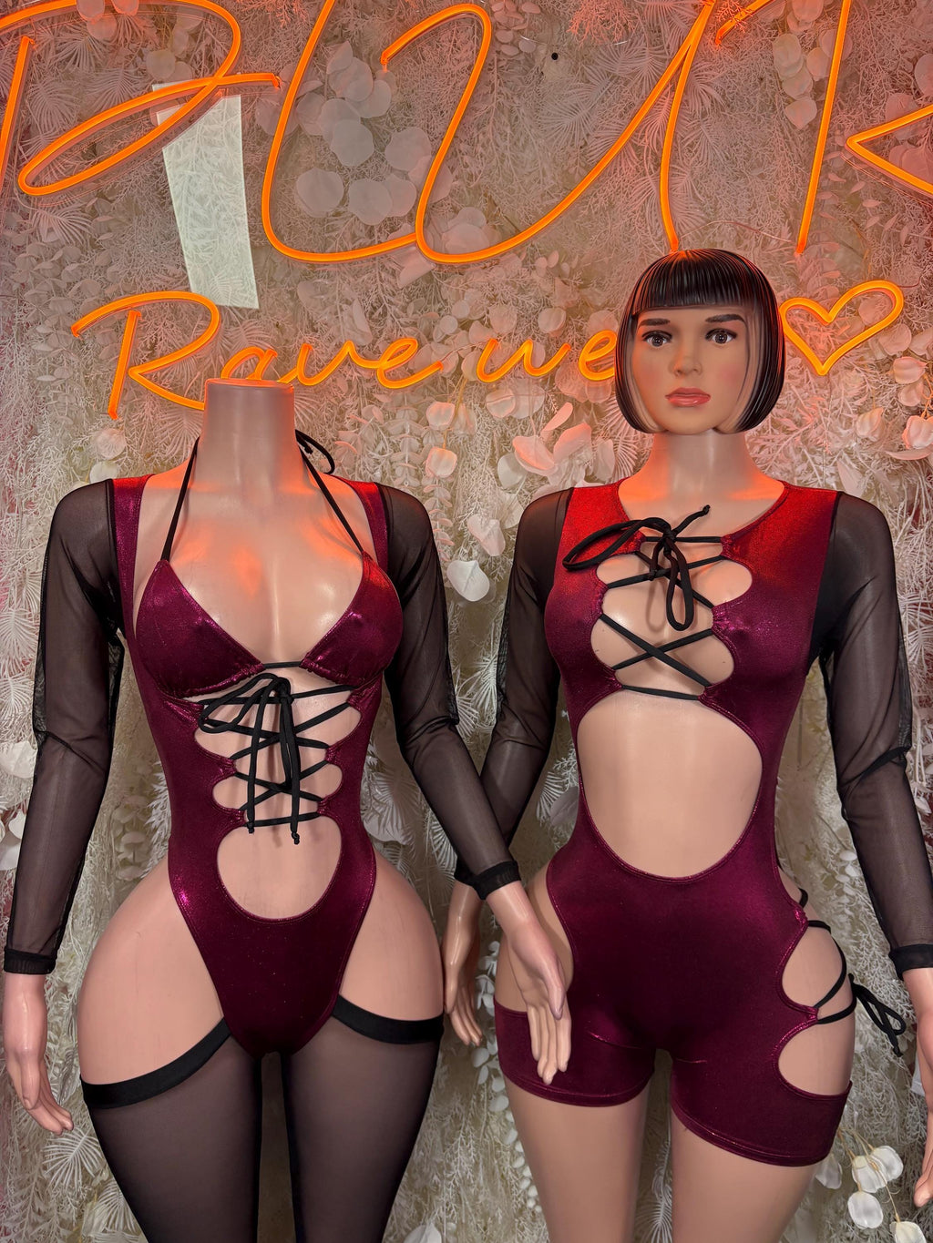 Burgundy satin bodysuit with crisscross lace-up chest and sheer black sleeves