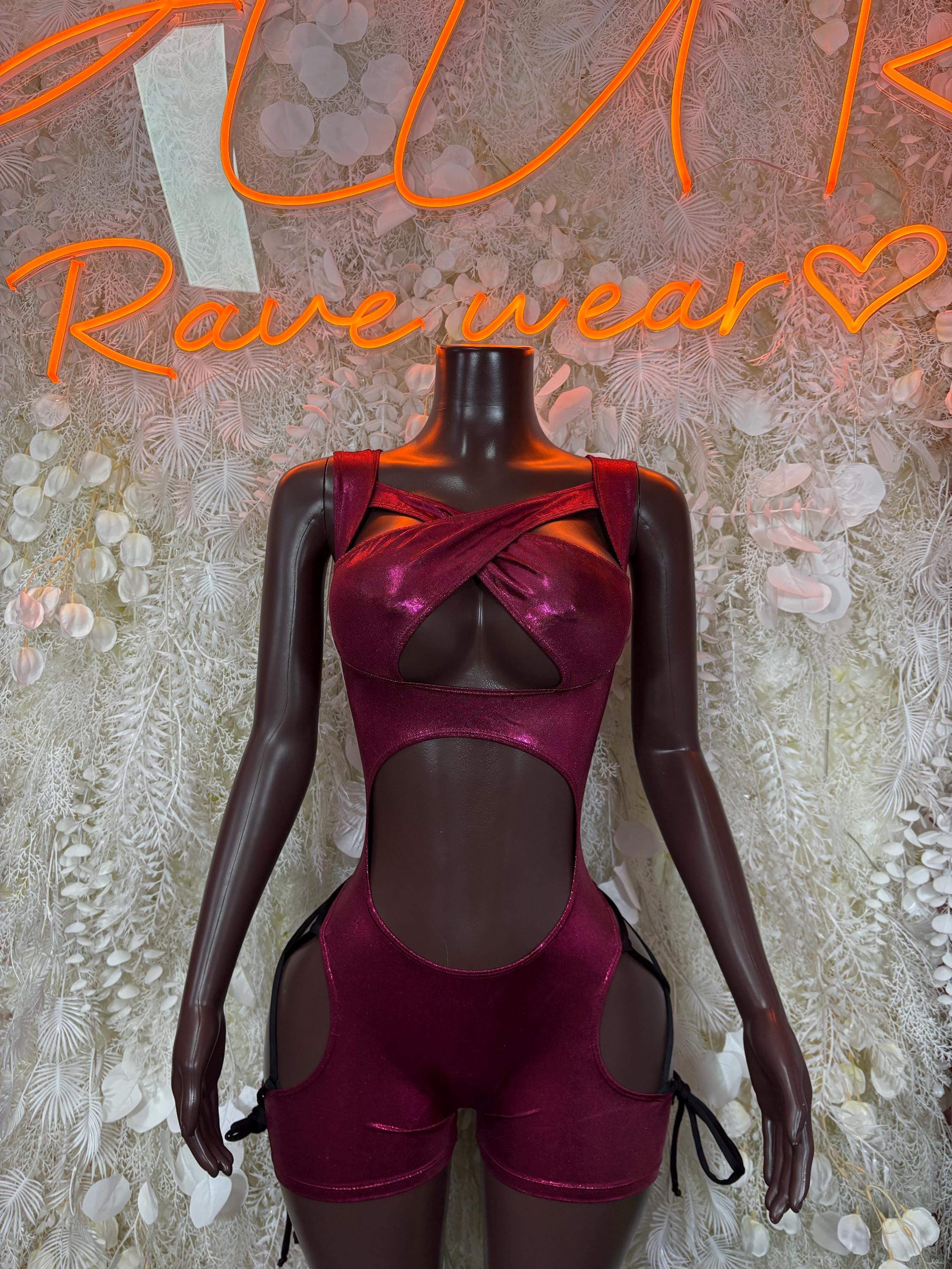 Burgundy long-sleeve bodysuit with glossy finish, high waist cutouts and thigh panels