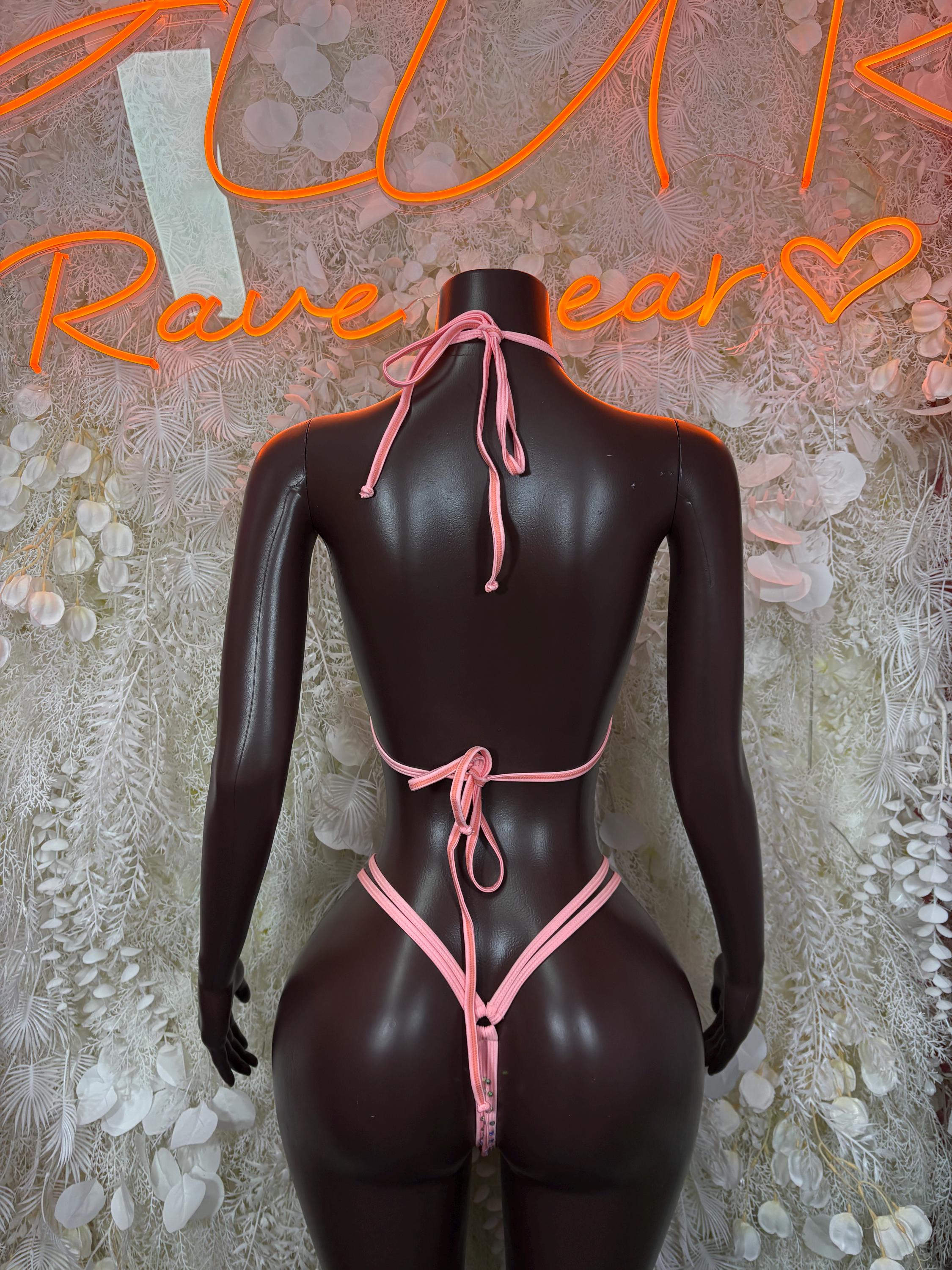 Pink rhinestone bikini set back view with triangle bottoms and tie straps on dark mannequin