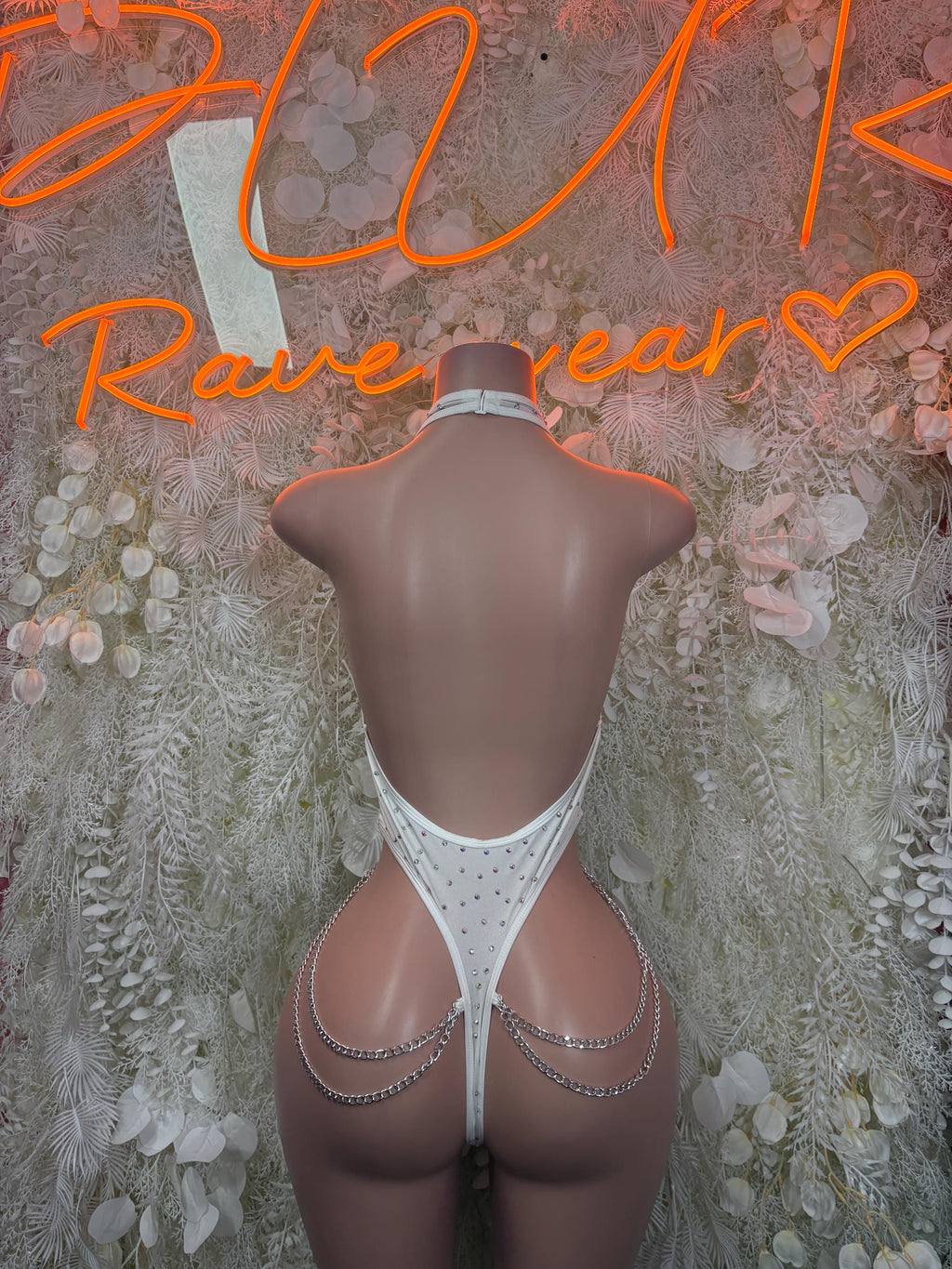 White rhinestone chain bodysuit with open back and high-cut legs