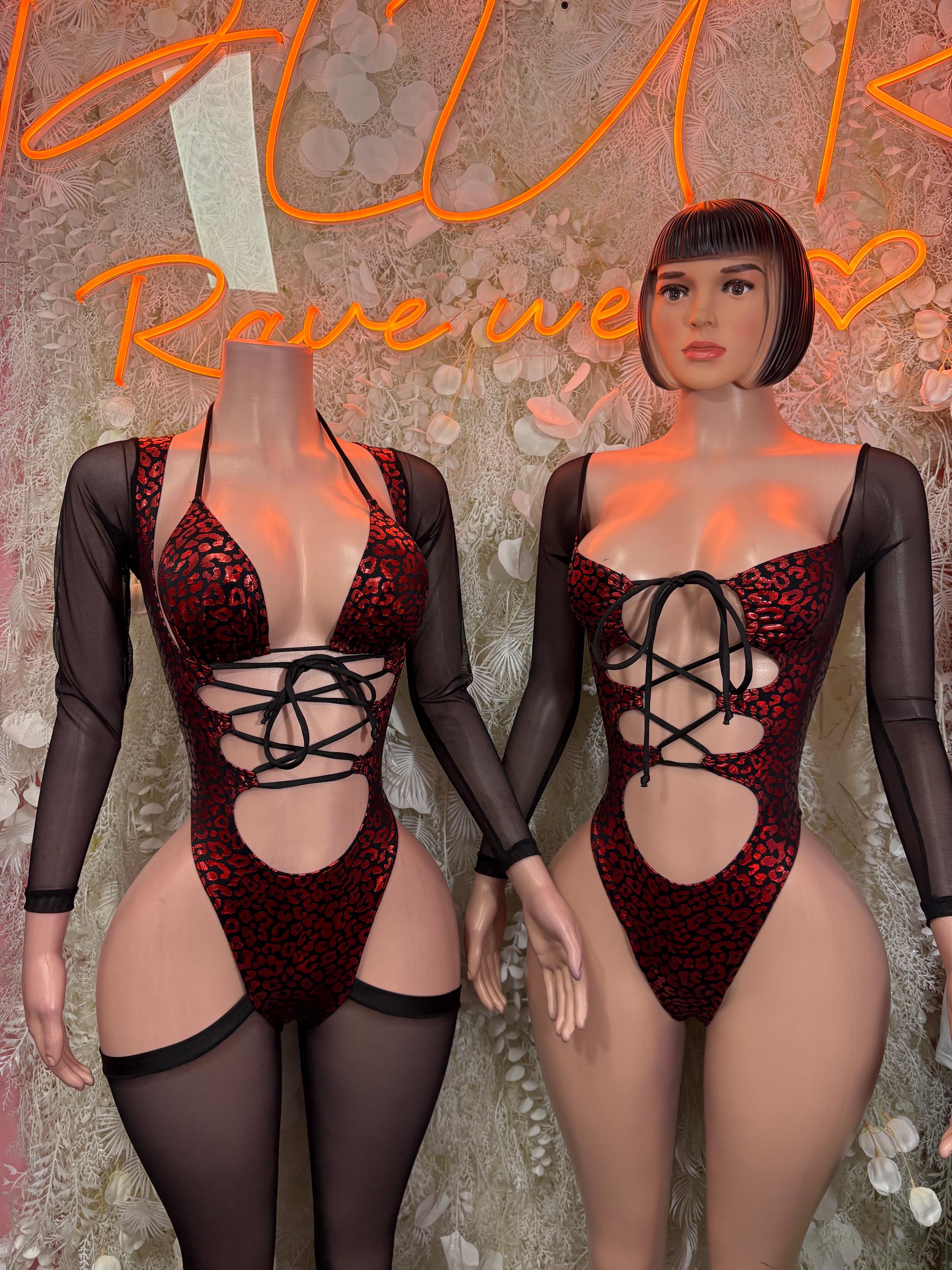 Red patterned metallic bodysuit with black mesh sleeves and lace-up front cutout sides
