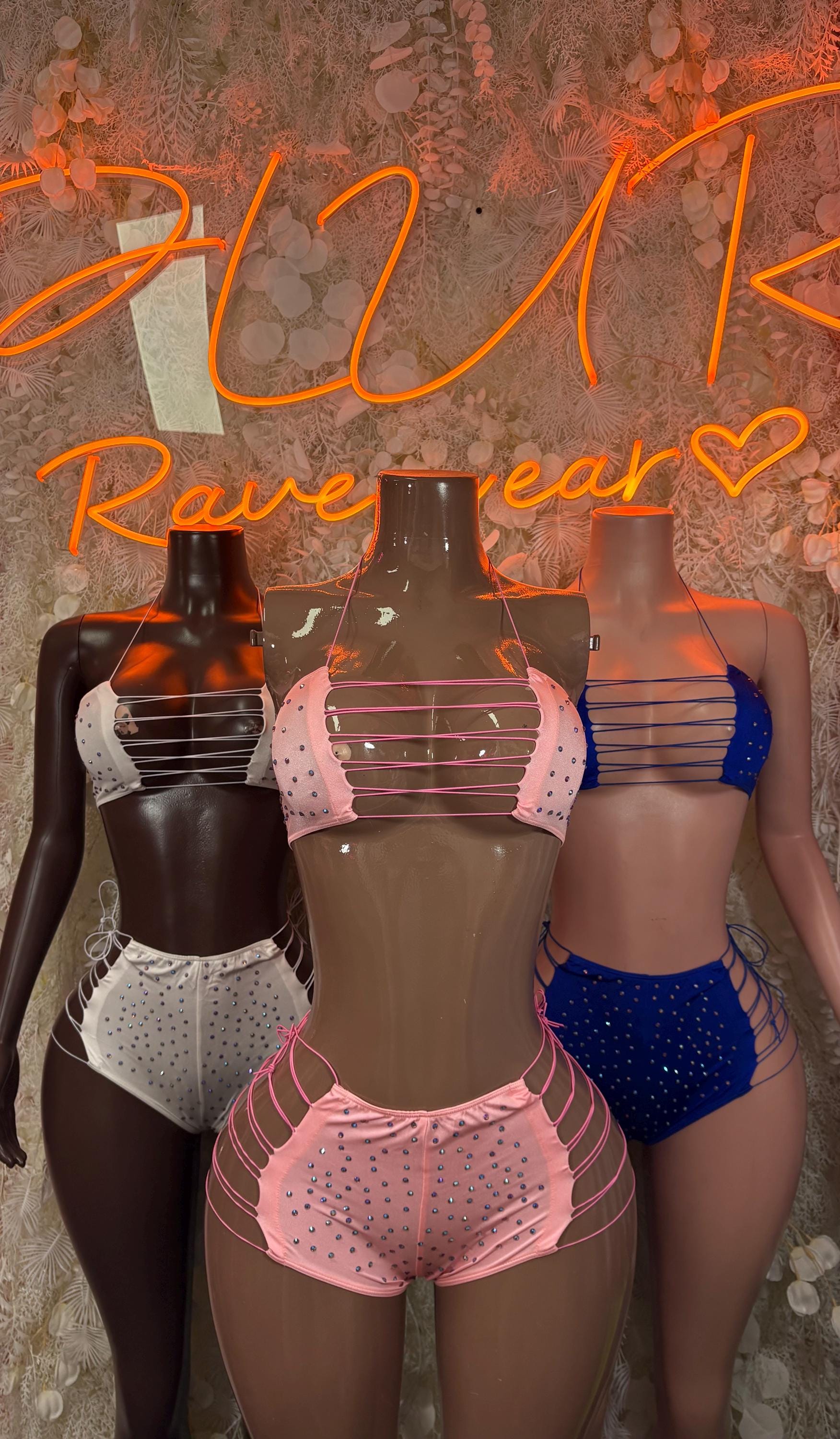 Three rhinestone bikini sets: white, pink, and blue with strappy tops and shorts