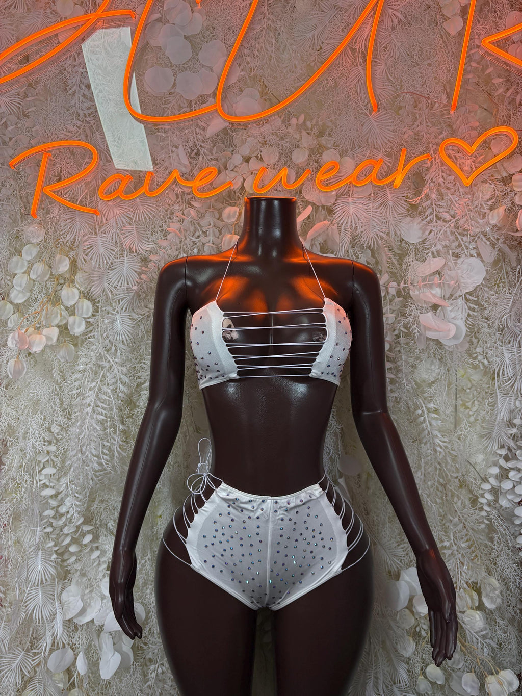 White rhinestone bikini top and high-waist bottoms, halter straps and lace-up sides