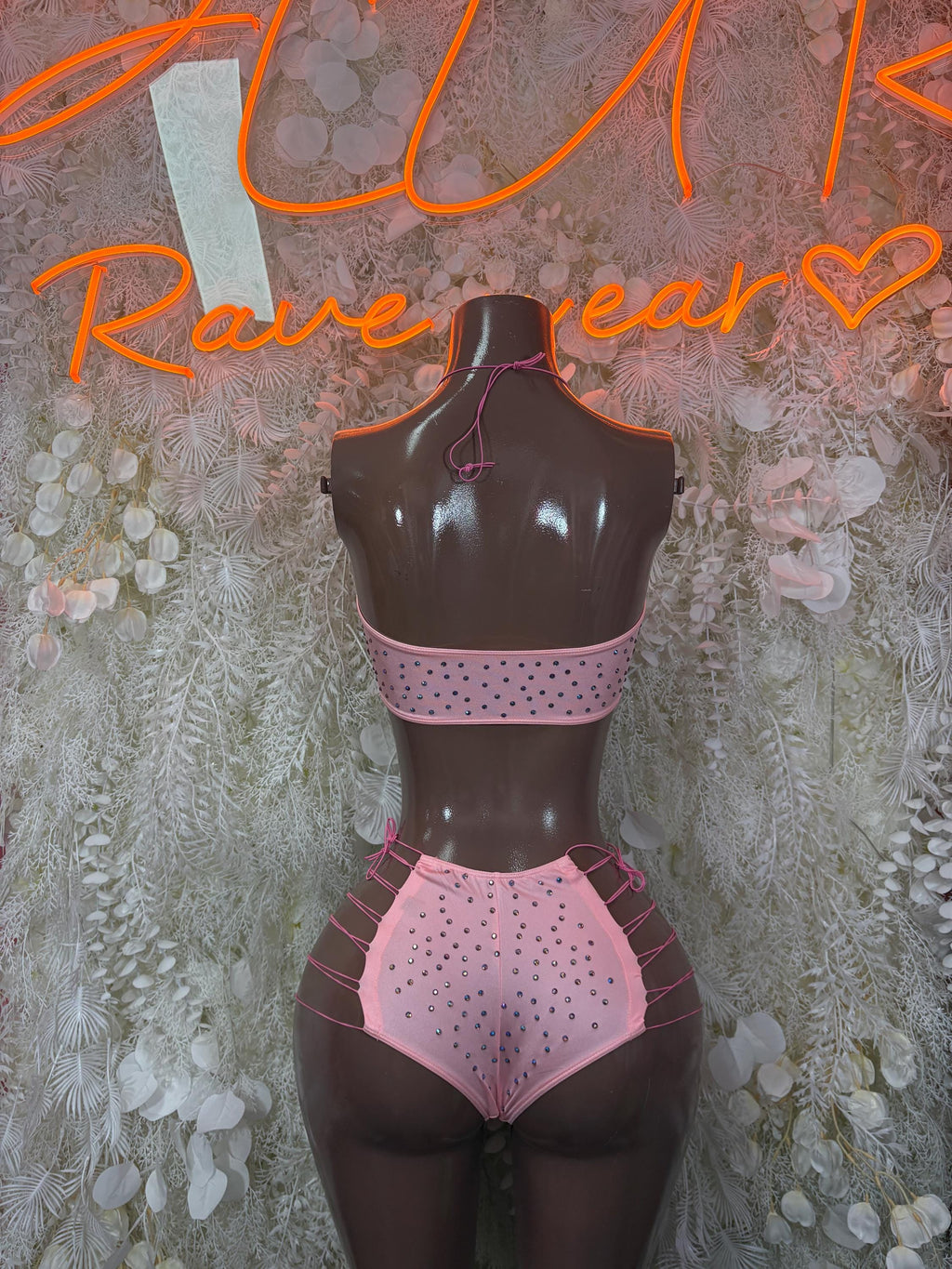 Pink rhinestone bikini set shown from back with halter straps and briefs