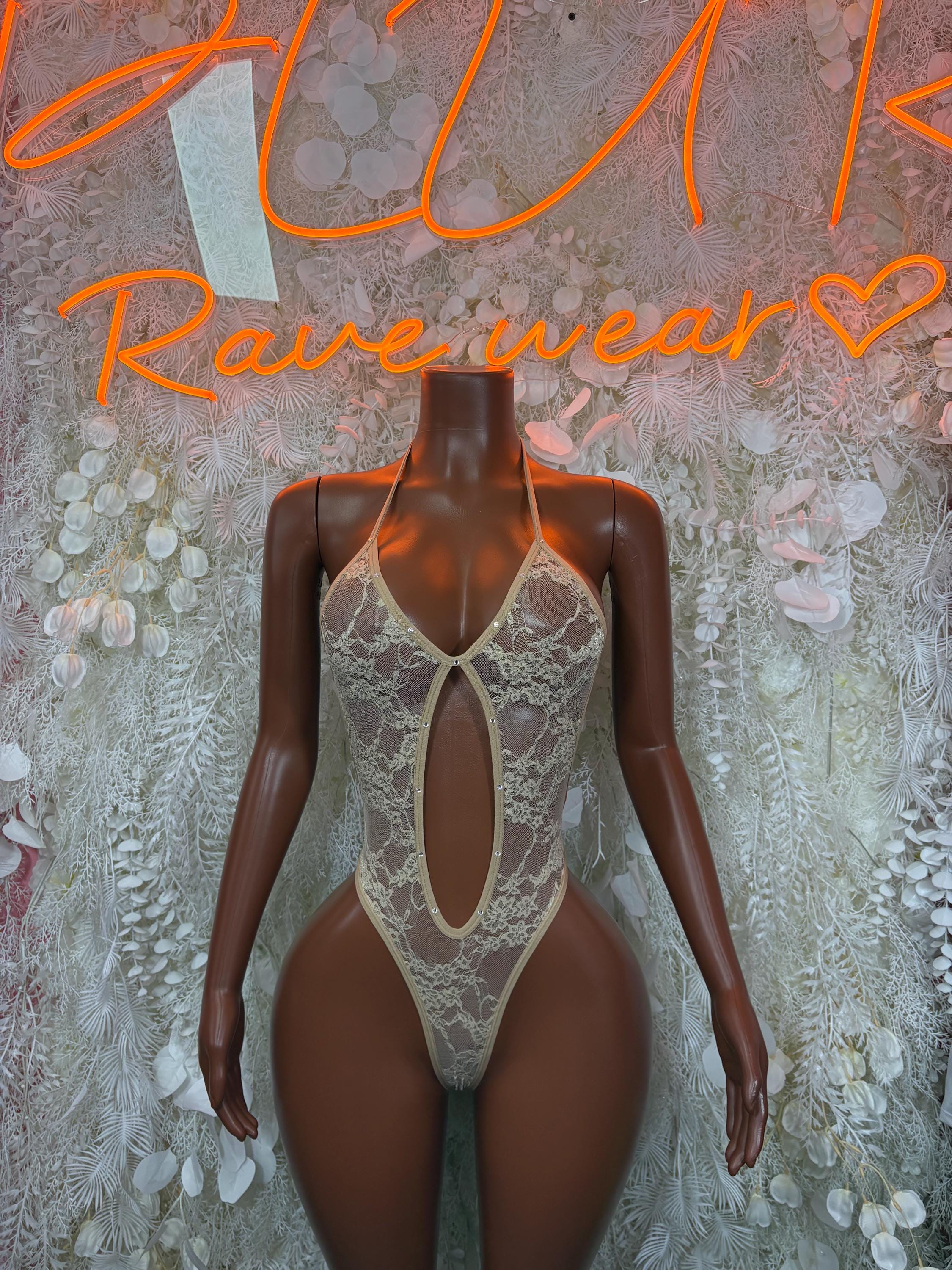 Tan lace bodysuit with deep V front and teardrop cutout, tie-back straps