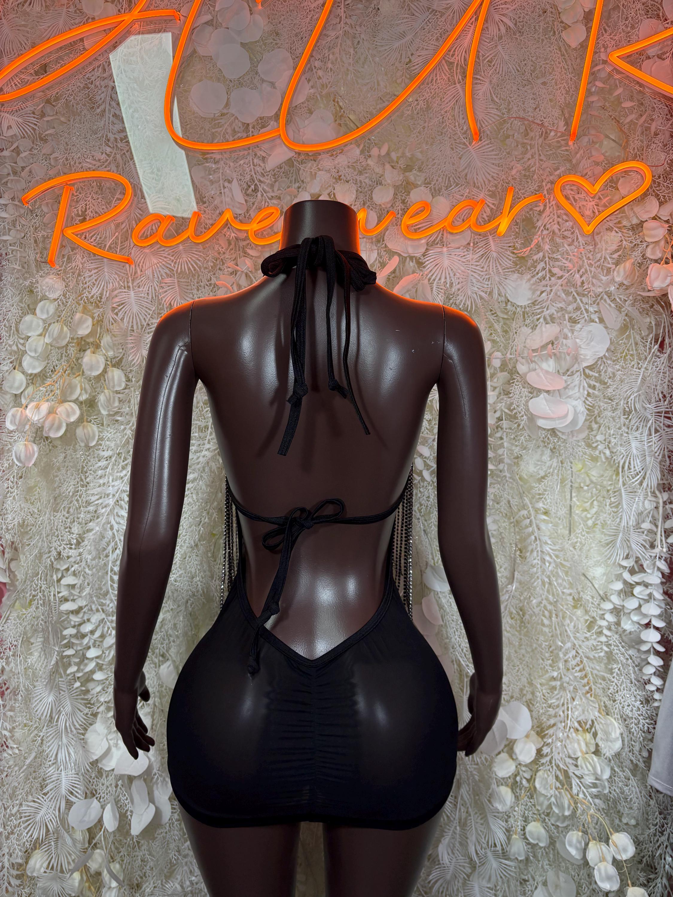 Black halter mini dress, open back with tied straps and V-cut upper